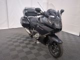 a motorcycle that is parked on a checkered floor