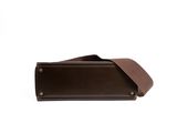a close up of a brown leather case on a white background