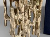 an image of a sculpture of a group of people on top of a base