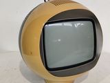 a small television sitting on top of a white table