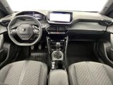 the interior of a car with a steering wheel and dashboard controls