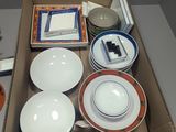 a box with a variety of plates and bowls in it