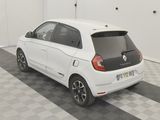 a picture of a small white car parked in a garage
