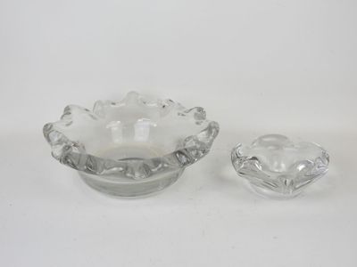 pair of clear glass ashtrays on a white background