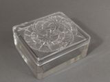 a glass box with a design on it on a table