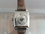 a watch that is sitting on top of a wooden table