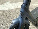 a scooter that is sitting on the pavement