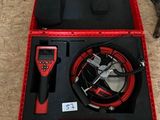 a red box with a black and red hose and a red box with a black hose and a red box with a black hose and a black hose