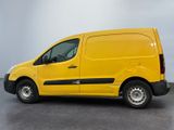 the yellow van is parked in the empty room of the building