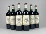 six bottles of wine are lined up in a row