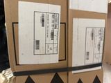 two boxes are stacked on top of each other on a table