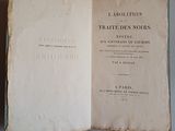 an old book opened to show the title of a novel