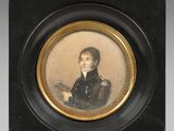 portrait of a young man in a black coat holding a book