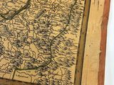 an old map on a piece of paper with a ruler