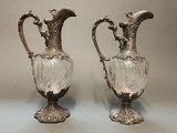 pair of antique silver plated glass vases on a table