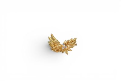 an 18k gold and diamond leaf broochle