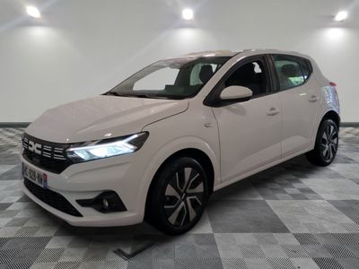 a white car is parked in a room with a checkered floor