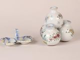 three vases that are sitting on top of each other