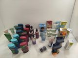 many different types of skin care products displayed on a table