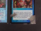two cards on the table with a knife in front of them