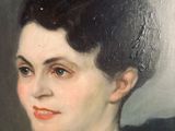 portrait of a woman in a black dress with a pink sash
