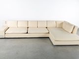 an image of a white sectional couch with a chaise lounger