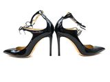 a pair of black high heeled shoes on a white background