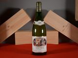 a bottle of wine that is sitting on a table