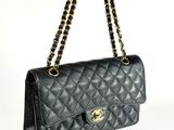 a black chanel bag on a white background