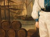 portrait of a boy in a sailor ' s outfit standing in front of a ship