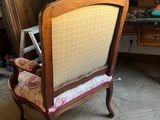 a chair that is sitting in the corner of a room