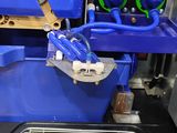 an image of a blue machine with a yellow object