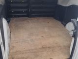 the back of a van with a bed in the back of it