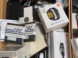 a cardboard box full of electronic devices and other items