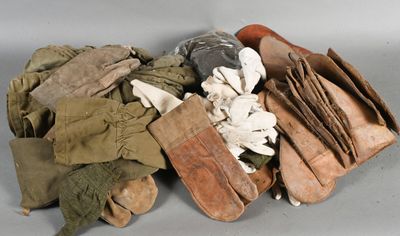 a pile of gloves and gloves sitting on a table