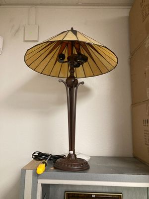 a lamp that is sitting on top of a microwave