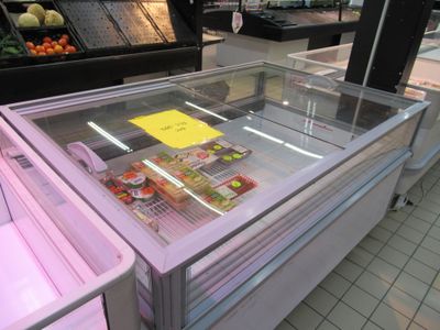 a refrigerated display case in a grocery store