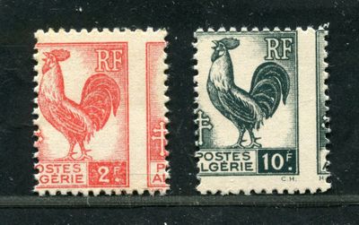 two stamps with a rooster and a rooster on them on a black surface