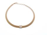 a close up of a gold necklace on a white background