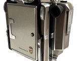 a silver camera that is sitting on top of a table