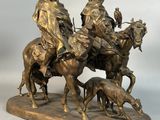 statue en bronze représentant un homme à cheval accompagné d'un chien, un homme à cheval accompagné d'un chien et un homme à cheval accompagné d'un chien
