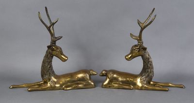 pair of brass deer figurines with antlers on legs