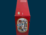 a red box with a picture of a christmas tree inside of it