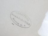 a close up picture of a white plate with a label on it