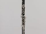 a close up of a clarinet on a stand with a white background
