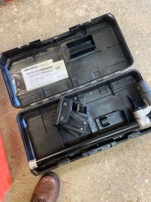 a black case with a gun in it on the ground