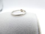 a ring that is sitting on top of a pillow