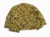 a close up of a camouflage jacket on a white background