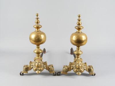 pair of antique brass candlesticks on cast iron bases