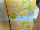 three boxes of jollyy baby food sitting on top of a cardboard box